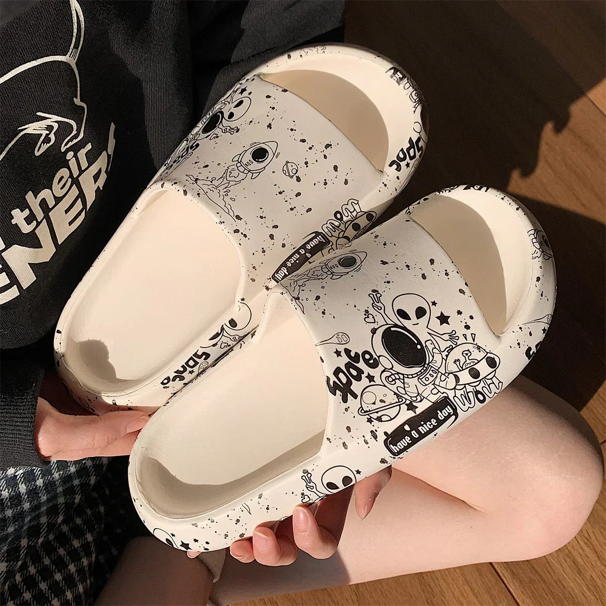 Beige foam slides with black space and alien cartoon print, casual streetwear footwear