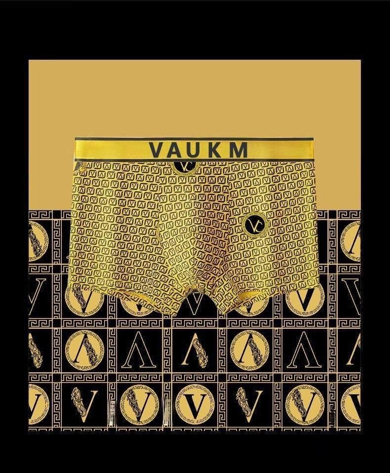 Gold and black geometric patterned boxer briefs with elastic waistband and bold fitted style
