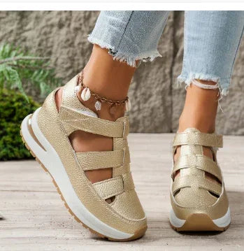 Gold platform sandals with cut-out straps, chunky sole, and modern streetwear style.