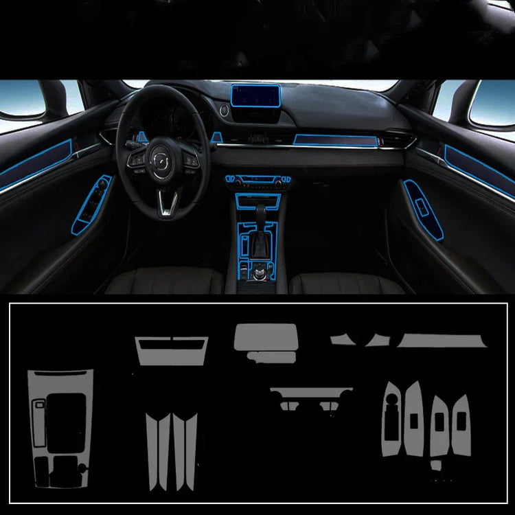 Car interior with ambient blue LED trim highlighting dashboard, doors, and center console.