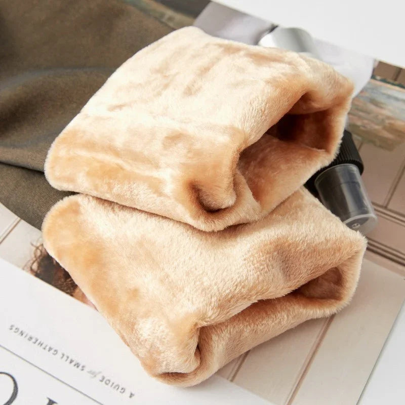 Close-up of beige faux fur sleeves, soft plush material, relaxed fit streetwear style.