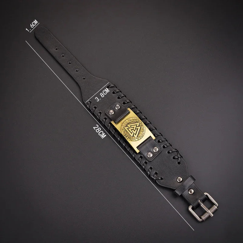 Black wide leather bracelet with metal buckle, gold emblem, and adjustable fit