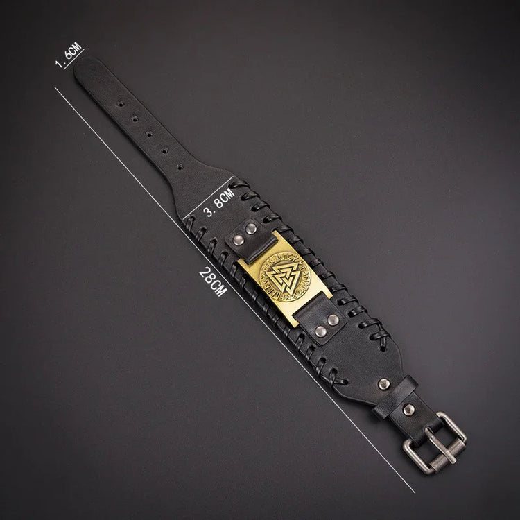 Black wide leather bracelet with metal buckle, gold emblem, and adjustable fit
