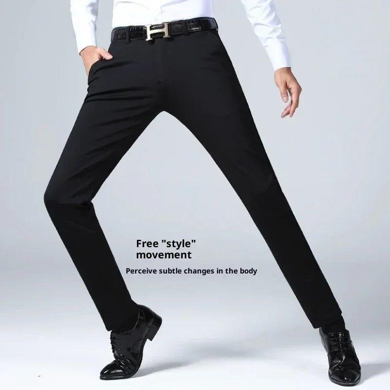 Slim fit black dress pants with stretch material and a modern tapered leg, styled for movement.
