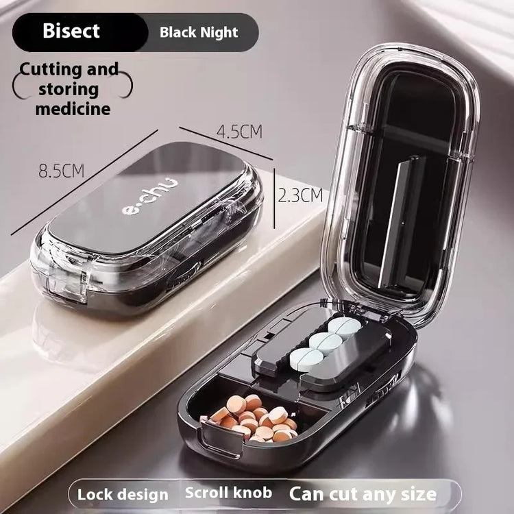 Compact black transparent pill cutter and storage case with divided compartments and secure lock, suitable for organizing and splitting medicine tablets.