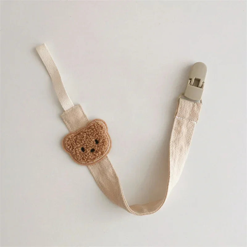 Beige cotton strap with crocheted bear face applique and plastic clip, cute accessory