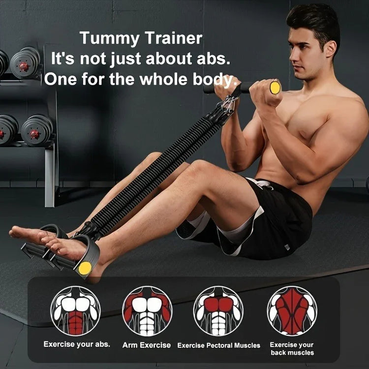Man wearing black athletic shorts using resistance bands for full body workout, seated on gym mat.