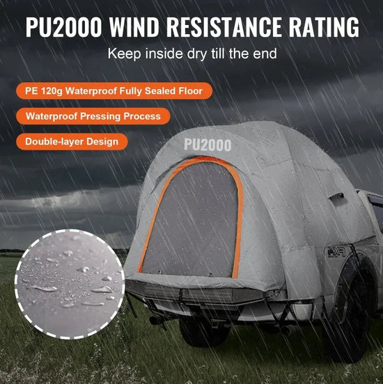 Gray waterproof truck tent with orange trim, double-layer design, shown in heavy rain