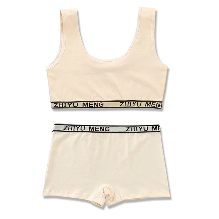 Beige cotton lounge set with tank top and shorts, black elastic waistband, relaxed fit