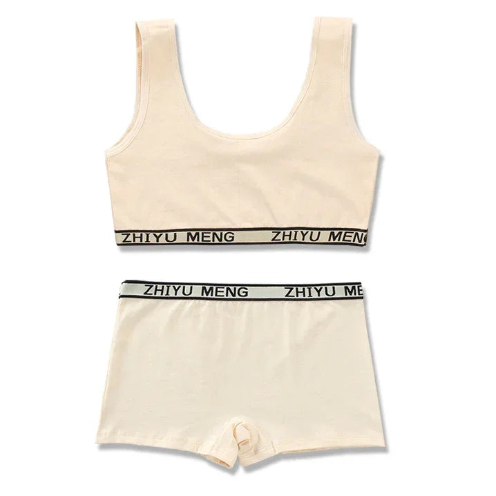 Beige cotton lounge set with tank top and shorts, black elastic waistband, relaxed fit