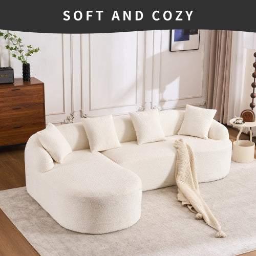 Curved white boucle sectional sofa with plush cushions in modern living room setting