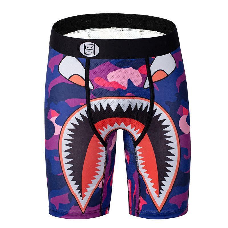 Purple camo compression shorts with graphic shark mouth design and snug athletic fit