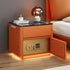 Modern orange bedside table with safe, black glass top, and ambient lighting