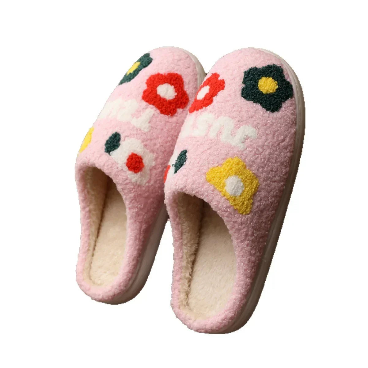 Pink fuzzy slippers with colorful floral pattern, cozy sherpa material, slip-on fit