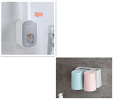 Wall-mounted toothbrush holder with two pastel-colored cups and plastic compartment.