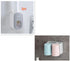 Wall-mounted toothbrush holder with two pastel-colored cups and plastic compartment.