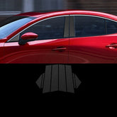 Black carbon fiber texture car door pillar trim on red sedan, modern automotive accessory