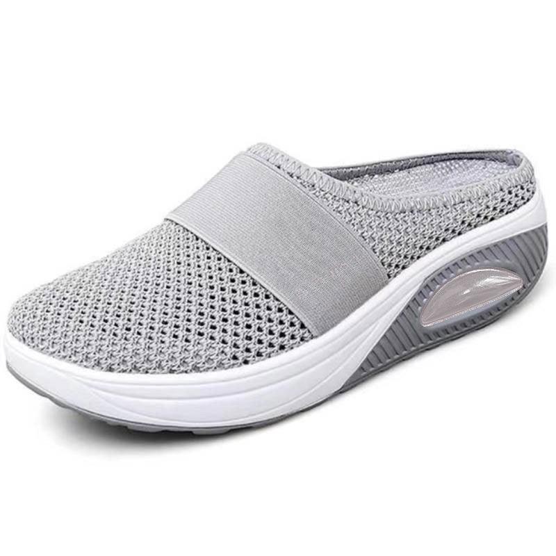 Light gray mesh slip-on sneaker with thick cushioned sole and breathable, lightweight design