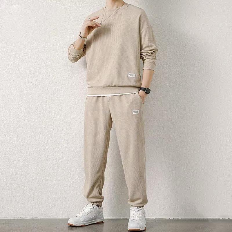 Beige waffle-knit sweatshirt and matching jogger pants, relaxed fit streetwear set