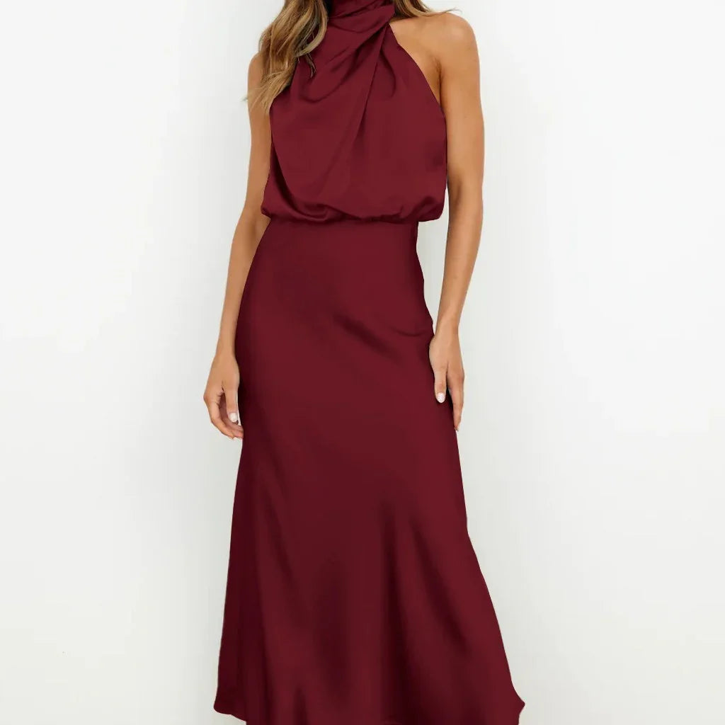 Sleeveless burgundy satin halter dress with draped neckline and relaxed fit