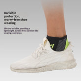 White knit sneaker with a black and neon green low-cut ankle sock, lightweight slim fit.