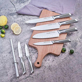 Set of stainless steel kitchen knives with textured handles on wooden cutting board, modern countertop.