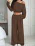 Woman wearing brown off shoulder long sleeve crop top and wide leg pants lounge set