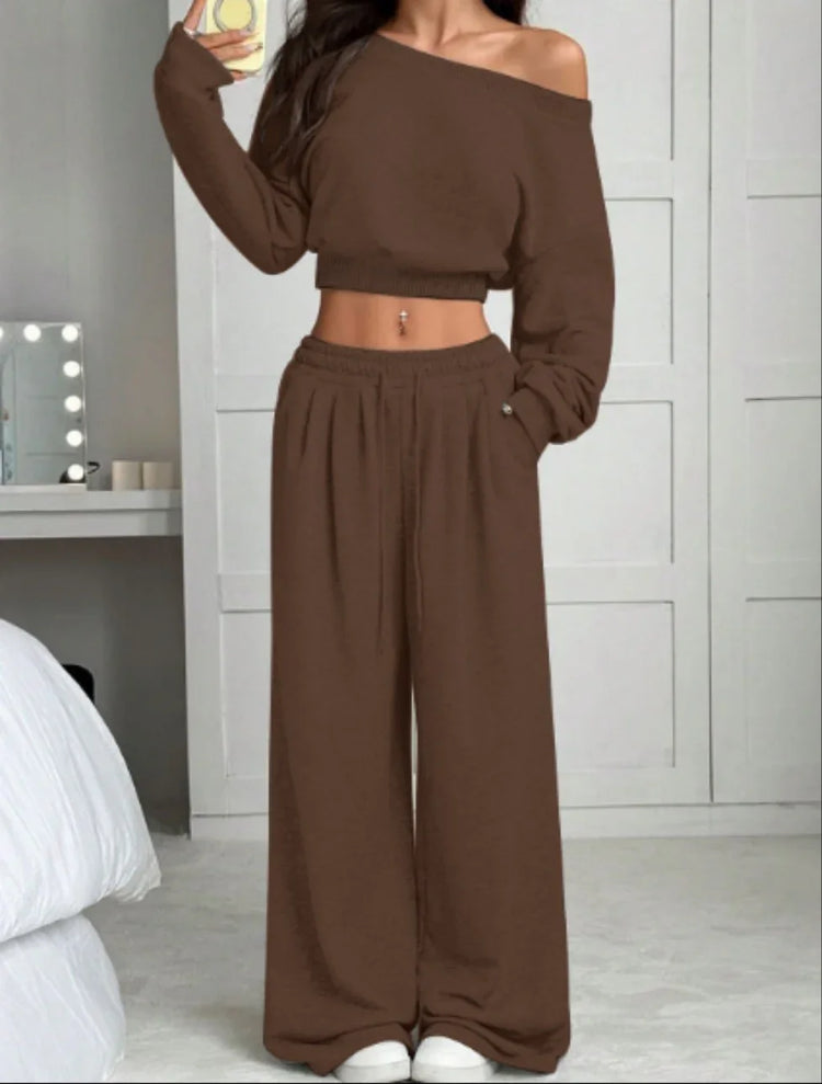 Woman wearing brown off shoulder long sleeve crop top and wide leg pants lounge set