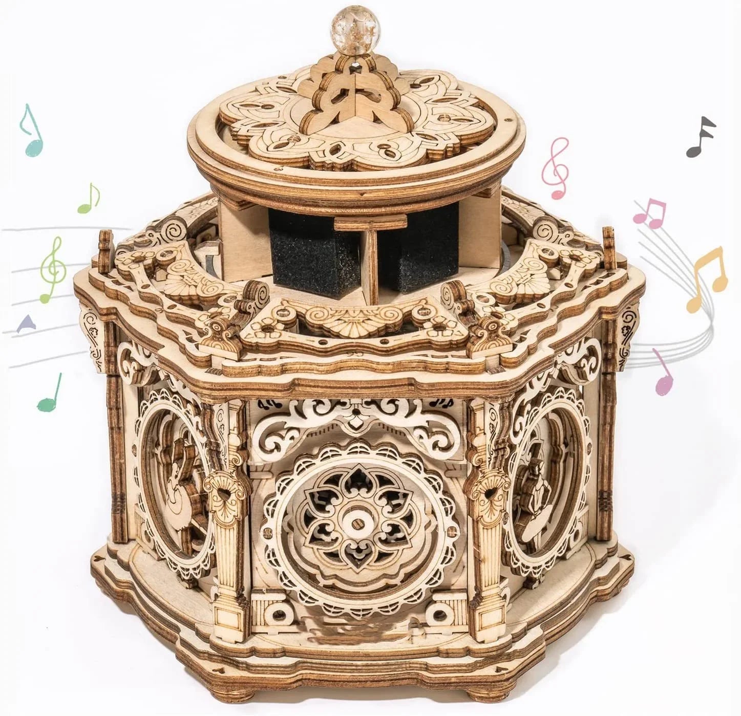 Intricate wooden music box with carved details and decorative wheels, vintage style.