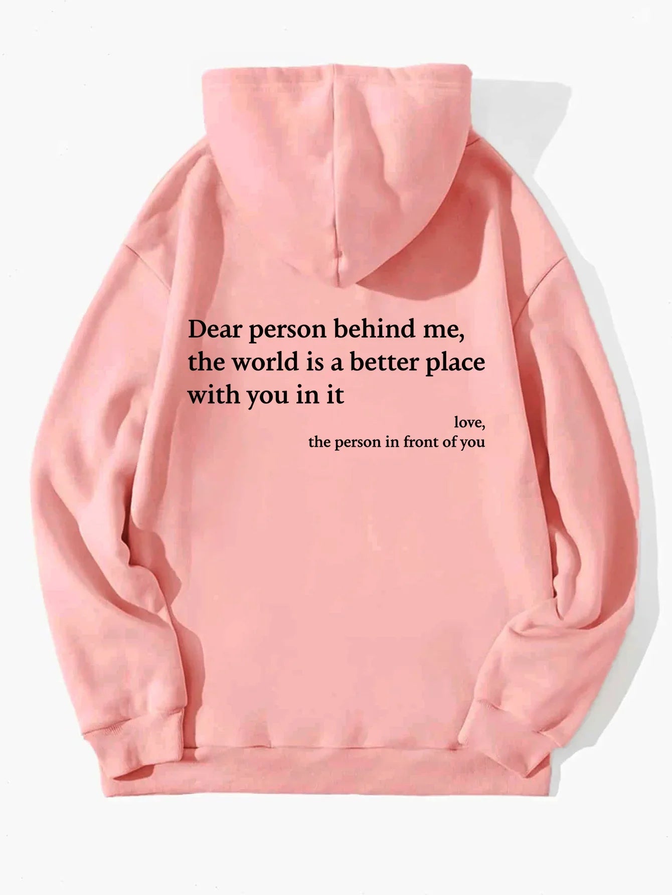 Pink fleece hoodie with positive message text on back, relaxed fit, soft streetwear style.