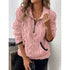 Woman wearing a pink plush fleece pullover with half-zip front and front pocket, relaxed fit.