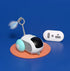 Futuristic remote control toy with light blue wheels and feather attachment, on blue background