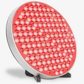 Round panel of red LED lights with silver rim on a black stand, tech accessory.