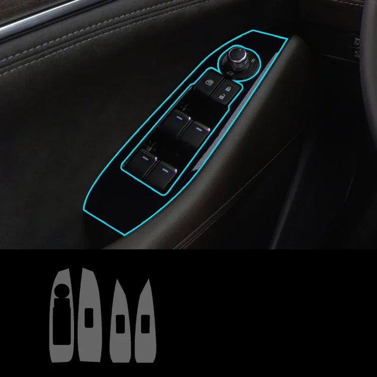 Black car interior door panel with illuminated power window switches and glossy trim