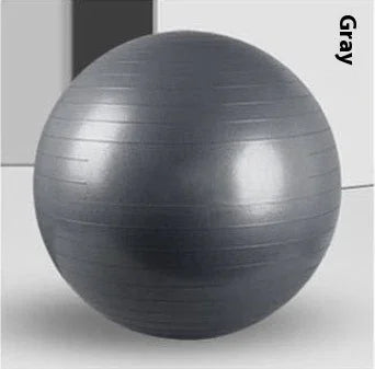 Gray fitness exercise ball with textured, non-slip surface, indoor minimalist setting