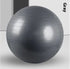 Gray fitness exercise ball with textured, non-slip surface, indoor minimalist setting