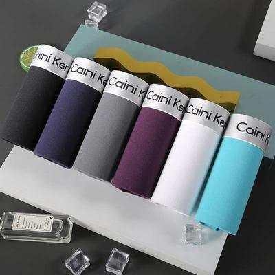 Assorted cotton streetwear socks in black, gray, purple, white, and blue, neatly rolled