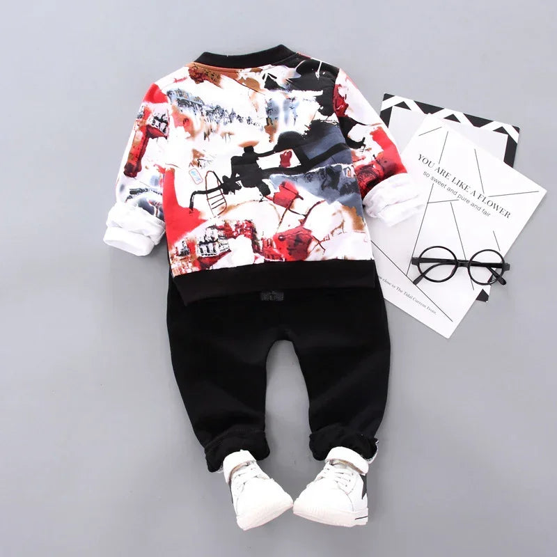Kids' streetwear outfit with abstract print sweatshirt, black jogger pants, and white sneakers