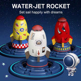 Colorful rocket-shaped toy water jets with astronaut figure on a starry background