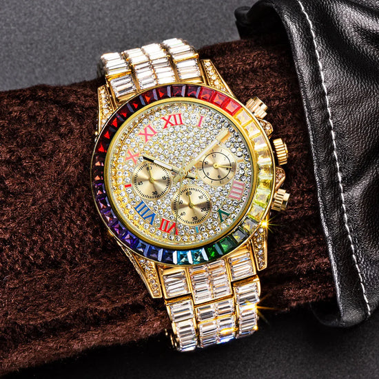 Gold luxury watch with multicolor crystal bezel, Roman numerals, and baguette link band