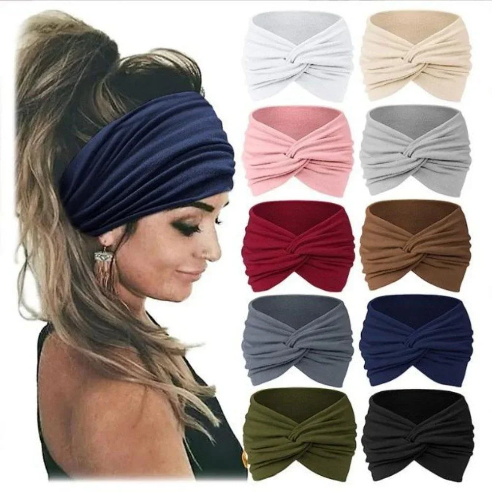Woman wearing a navy blue twisted knotted headband, shown with multiple color options, soft fabric, casual streetwear accessory.