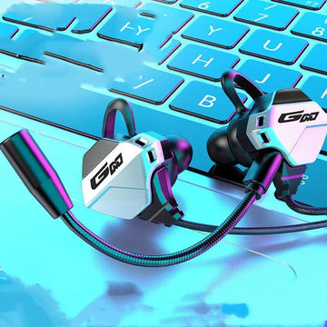 Futuristic metallic wireless earbuds with detachable microphone on a blue keyboard