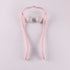 Pink plastic and white ball manual neck massager on white background