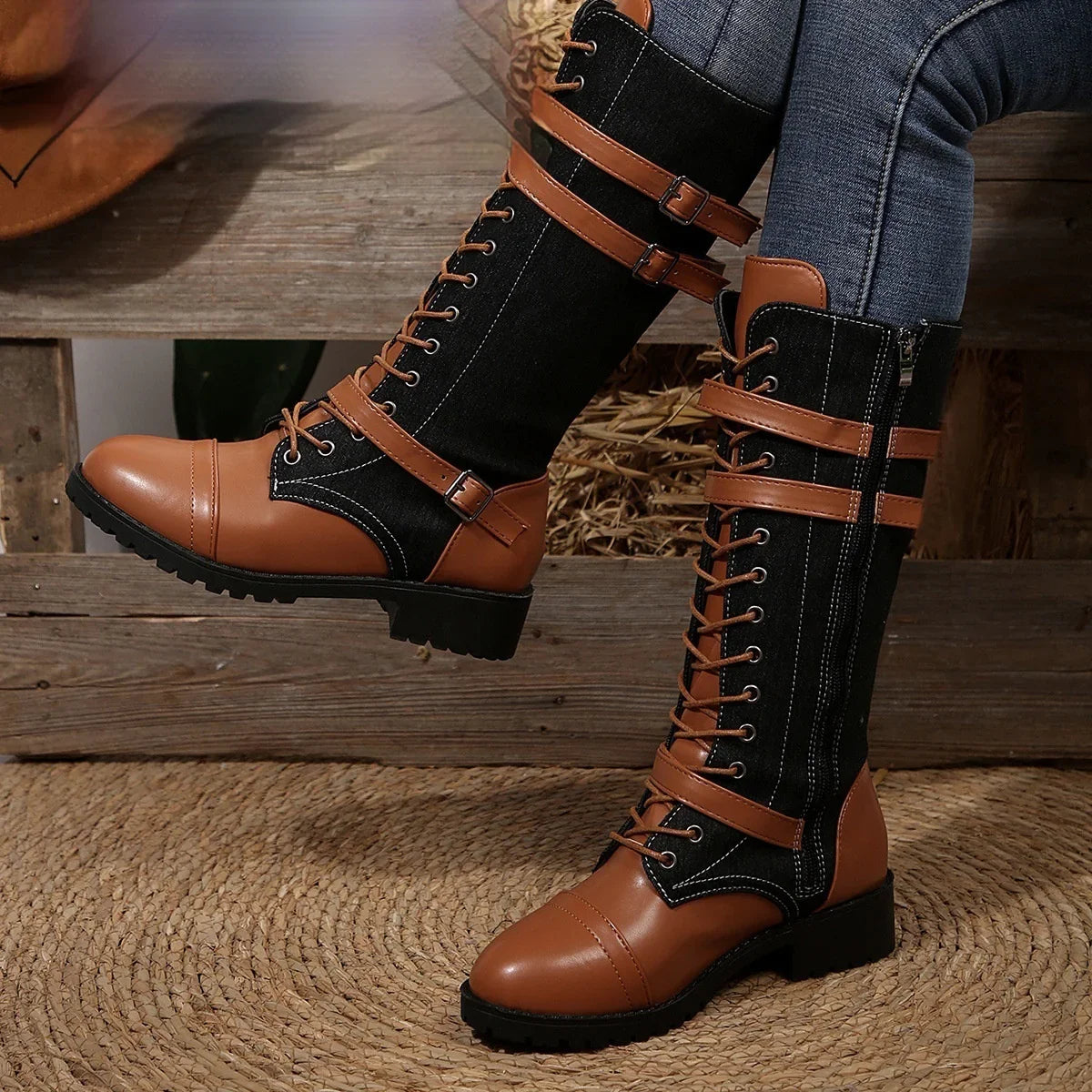 Brown and black knee-high lace-up boots with denim and leather look, rugged sole, fitted style