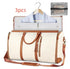 Cream and brown garment duffel bag with shoulder strap, dress shirt inside, travel pouch included