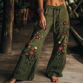 Olive green wide-leg pants with floral embroidery, drawstring waist, relaxed fit streetwear