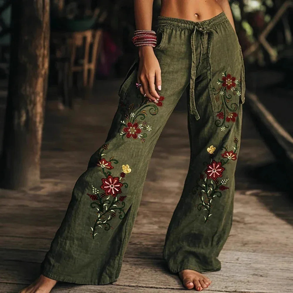 Olive green wide-leg pants with floral embroidery, drawstring waist, relaxed fit streetwear