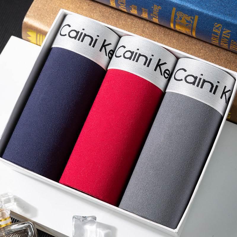 Boxed set of men's cotton underwear in navy, red, and gray with elastic waistbands