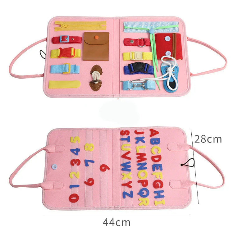 Pink interactive felt busy board with colorful buckles, straps, zippers, and alphabet letters, 44x28cm.