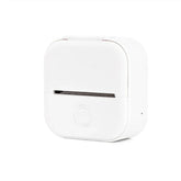 Compact white portable label printer with minimalist design on white background
